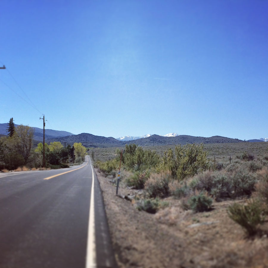 A road stretching toward distant mountains